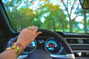 control driving image of left hand holding the steering wheel